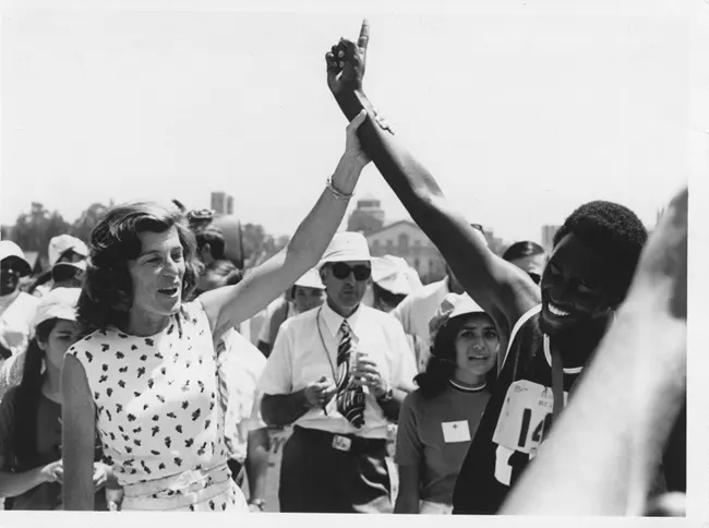 Eunice Kennedy celebrates with an athlete at the third Special Olympics Games. UCLA, California. 1972.