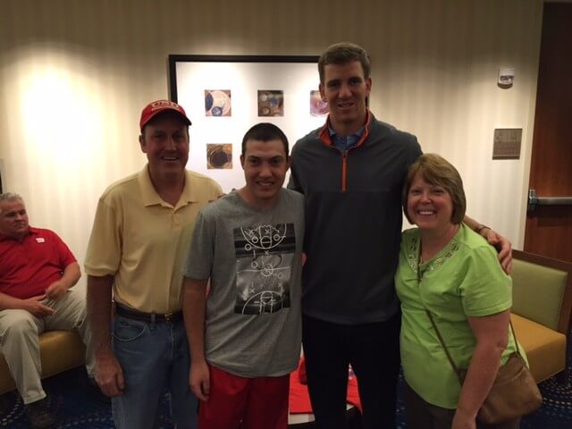 Jon Manning meeting his idol Eli Manning with his family.