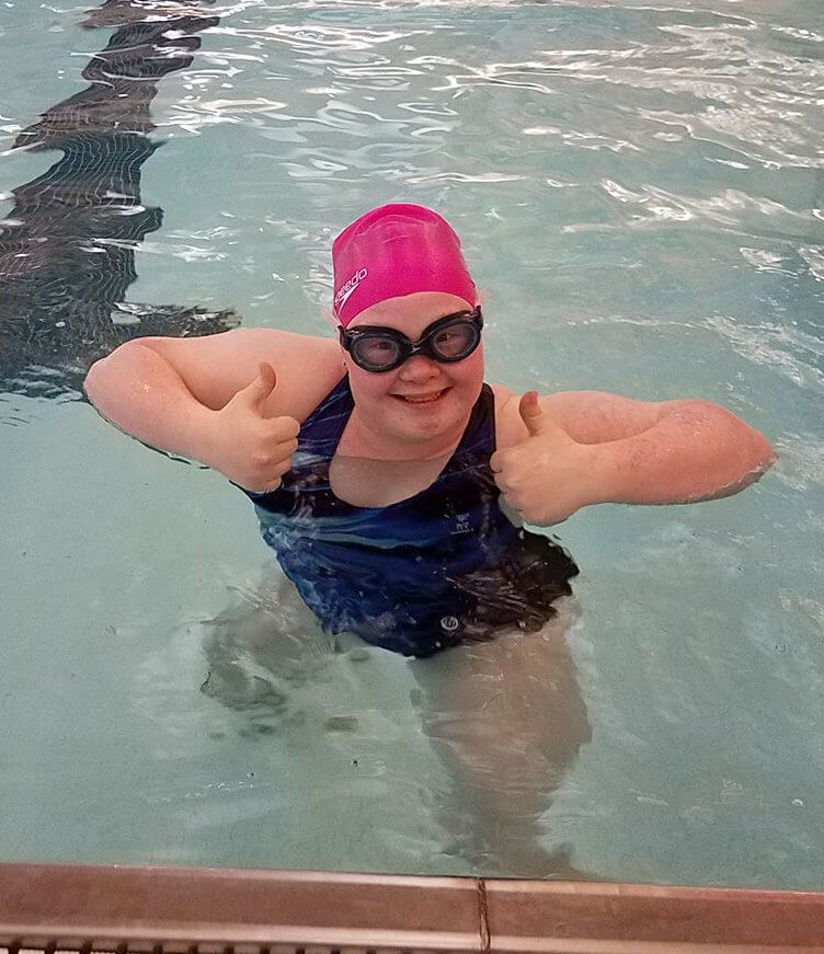 Addison Whitney, nominee for female athlete of the year, in the pool with her thumbs p.